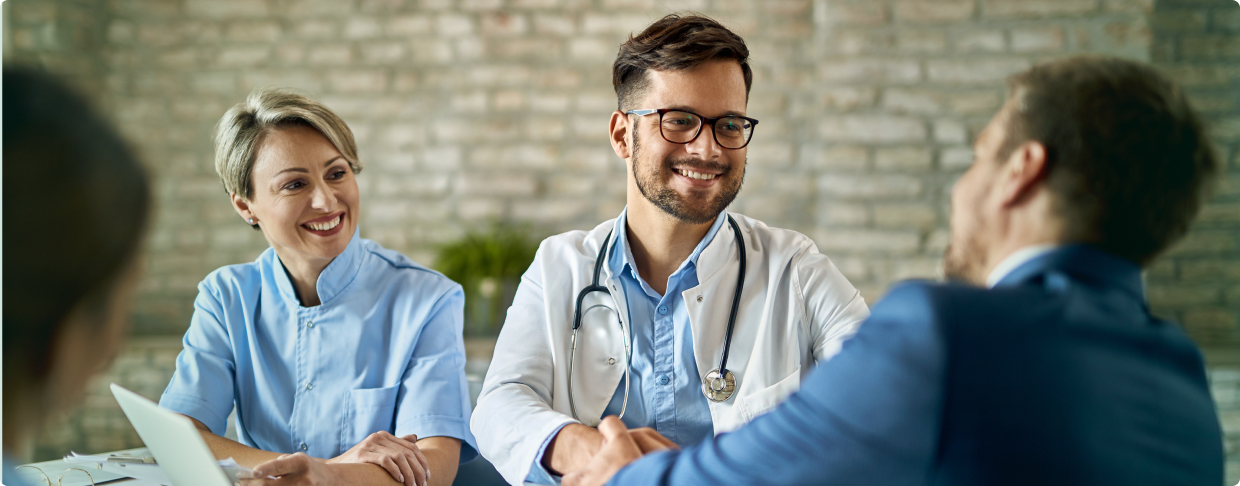 Patient Engagement Experience 1 Smiling healthcare professionals building patient trust through personalized consultation and engagement.