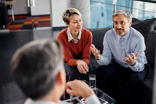 Professionals discussing AI-driven NLP solutions for improving compliance and healthcare data management.