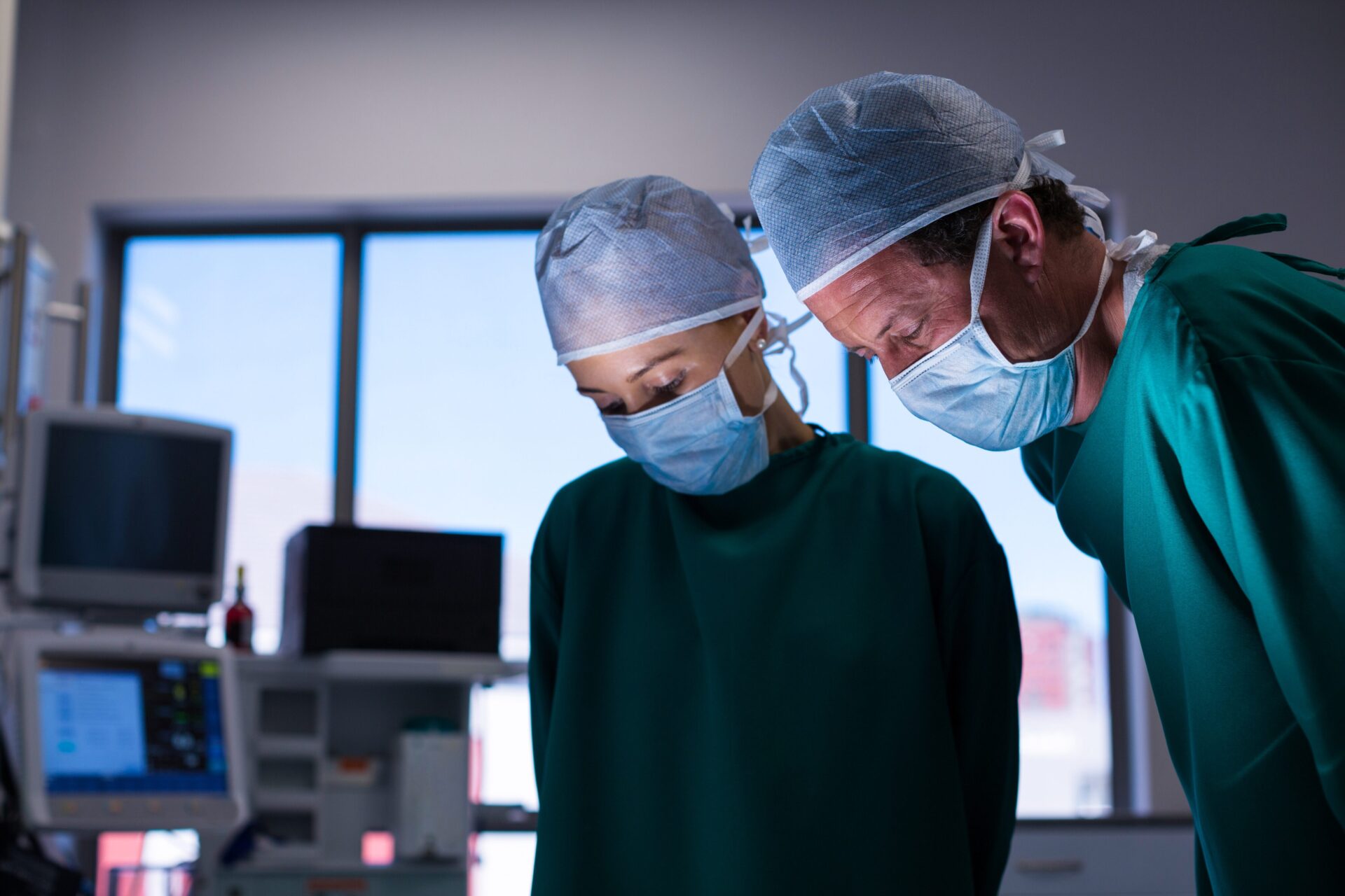 Clinical Intelligence & Decision Support 10 Doctor evaluating patient data to assess surgical risk, illustrating AI-powered risk stratification for personalized surgery planning.