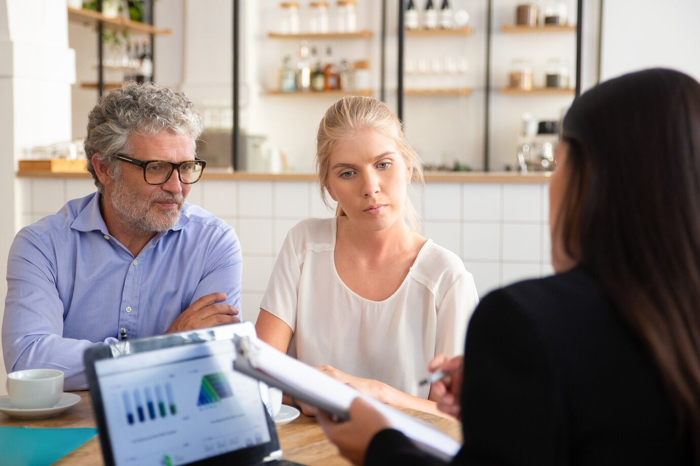 Revenue Cycle Management 1 Healthcare consultants discussing revenue cycle performance with clients using data dashboards