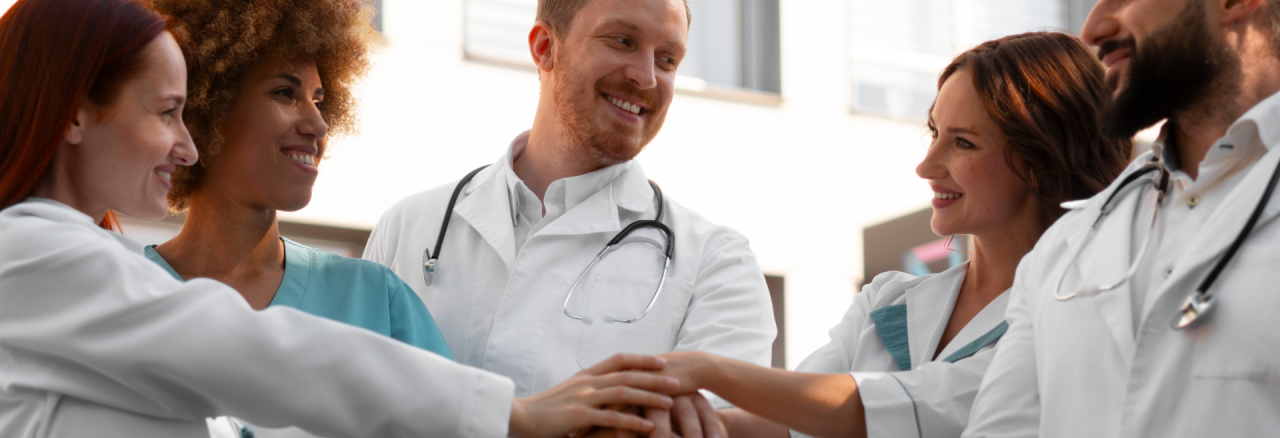 Clinical Intelligence & Decision Support 6 Smiling team of healthcare professionals collaborating, reflecting coordinated clinical decision-making and support systems.